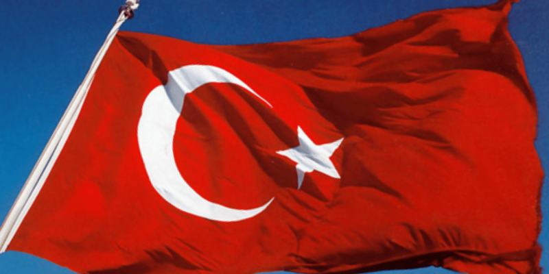 Turkish flag on a pole.